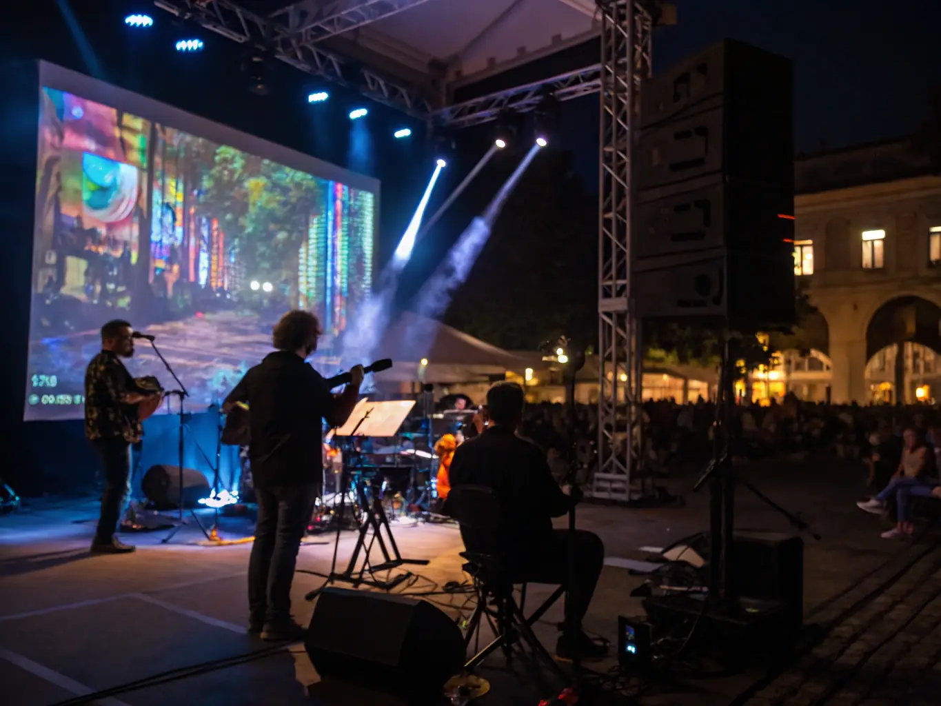 A captivating image of a live performance event, featuring musicians and artists collaborating on stage. The lighting and stage design create a visually stunning backdrop, enhancing the overall artistic experience for the audience.